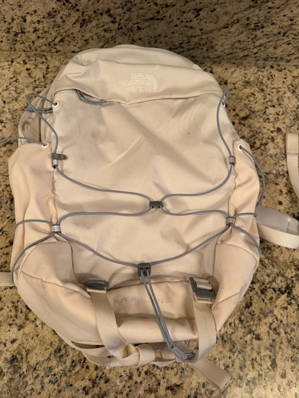 Cream colored the north face borealis backpack
